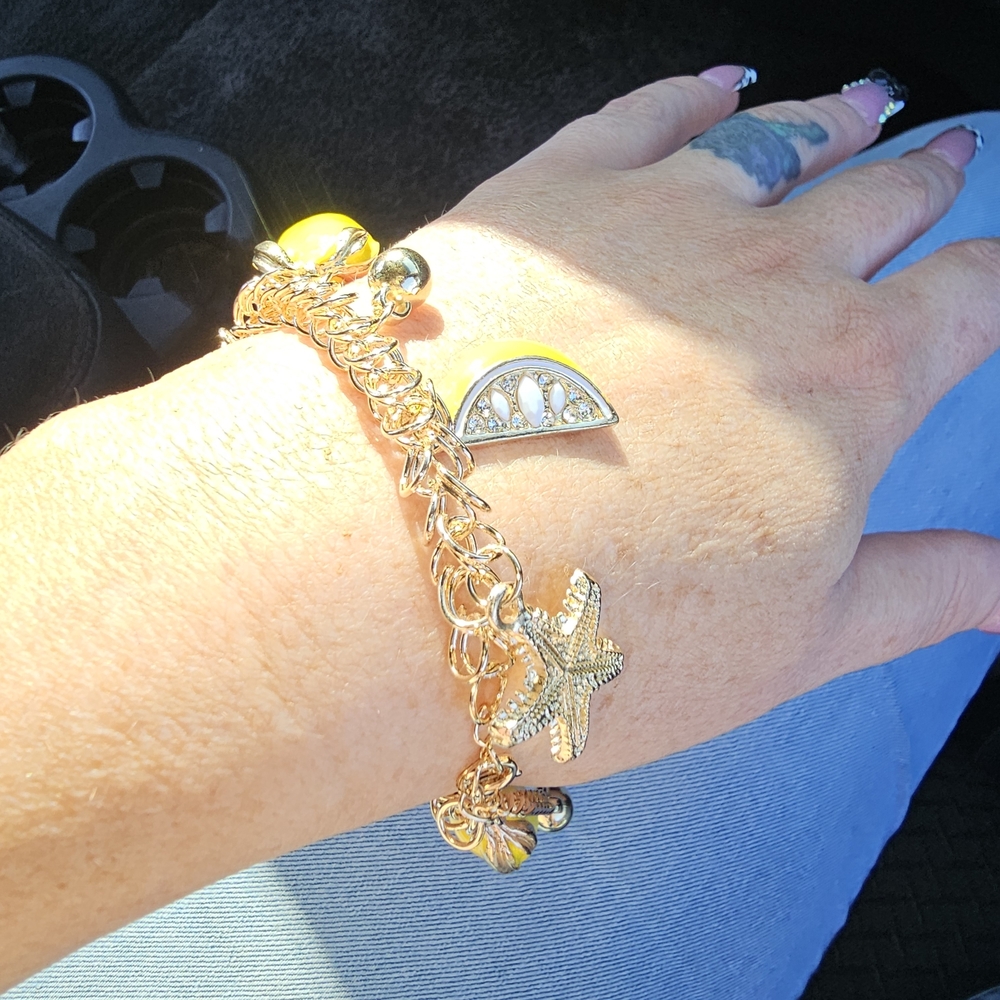 Gold-Tone Lemon Charm Bracelet with Starfish and Shell Accents